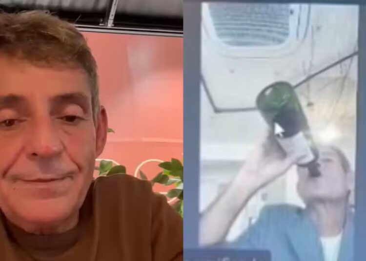 Juiz Milton Lívio Lemos Salles, que apareceu em sessão do TJMG bebendo vinho e fumando, gravou vídeo após repercussão de caso — Foto: Reprodução/Redes sociais